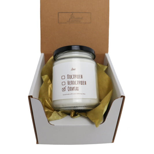 a white candle in a cardboard box Zinora.bg