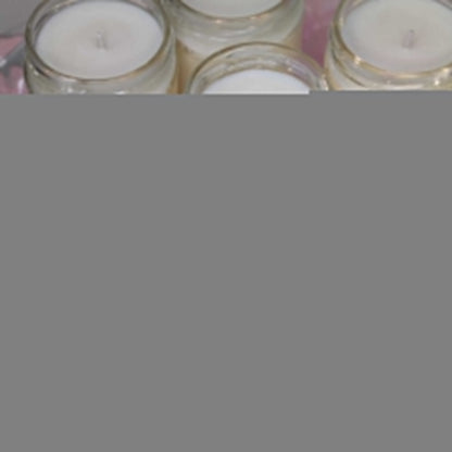 a close up of many small candles on a table